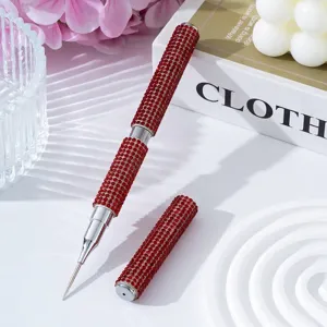 Detailed macro view of the double-headed red rhinestone nail art dotting pen metal tip