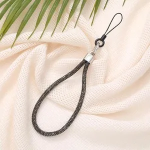 Close-up of 6mm sparkling diamond-encrusted mobile phone wrist strap in black