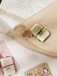 Mini PU leather notebook keychain pendant, cute furry pom pom bag charm and mini stationery.