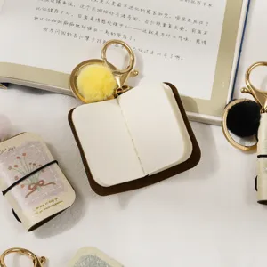 Mini PU leather notebook keychain with fluffy pom pom charm cute bag pendant backpack accessory