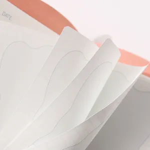 Close-up detail of grid paper pages in a portable pocket notebook diary
