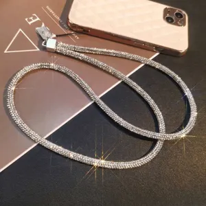 Detailed shot of a luxury sparkling rhinestone phone lanyard on a stylish background