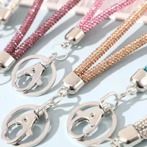 Close-up detail of luxury 6-row rhinestone sparkly phone lanyard with silver keyring