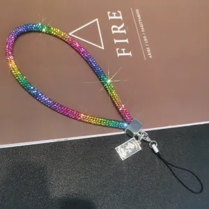 Macro view of luxury rainbow rhinestone phone wrist strap showing sparkling details.