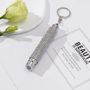 Elegant mini LED emergency flashlight keychain decorated with sparkling white rhinestones