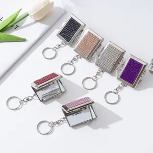 Sammlung von Mini-Strass-Schminkspiegel-Schlüsselanhängern in verschiedenen Farben.