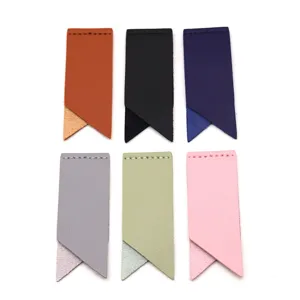 Detail view of colorful faux leather corner bookmarks, minimalist book page clips.