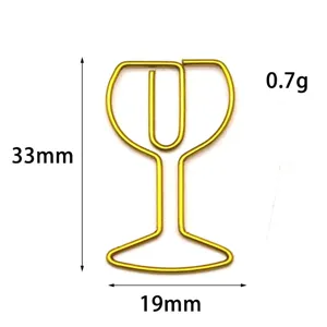 Gold wine glass shaped metal paper clip detail shot, creative office stationery supply clip.