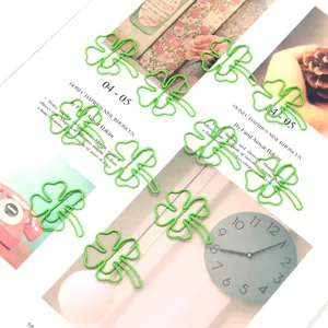 Cute green four-leaf clover paper clips, metal bookmark clips for office school stationery details