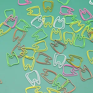 Creative tooth shaped metal paper clips in assorted colors for cute office stationery sorting.
