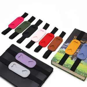 PU leather pen holder with elastic band for notebooks, planners and tablet cases.