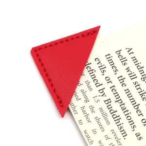 Red PU leather triangular bookmark detail, creative stationery office supply close-up view.