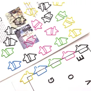 Closeup of colorful metal house shaped paper clips creative cute office stationery clips.