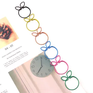 Creative orange shape metal paperclips, colorful cute stationery clips for office note organization.