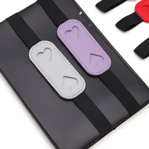 PU leather pen holder elastic band for notebook diary, cute heart cutout design accessory.