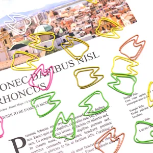Creative tooth shaped colored metal paper clips, cute office stationery for document sorting.