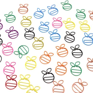 Cute assorted color metal paper clips shaped like sweet oranges for office school stationery decor.