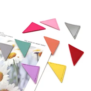 Colorful PU leather triangular book page corner clips, aesthetic stationery detail view.