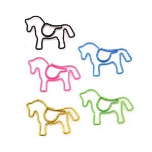 Close-up view of five colorful horse-shaped decorative metal paperclips for stationery.