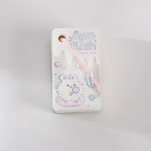 Acrylic cover pocket notebook detail showing cute bunny illustration and pink elastic strap.