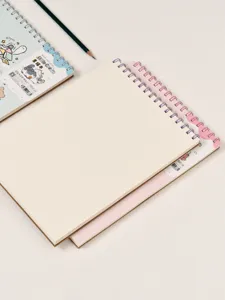 A4 spiral sketch book detail view, blank cream paper, cute cat illustration cover stationery.