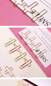Creative metal cross paper clips in gold and rose gold, perfect for office and bookmarks.