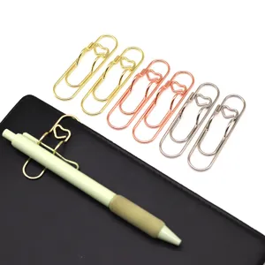 Close-up shot of creative heart-shaped metal paper clips and pen holders in assorted colors.