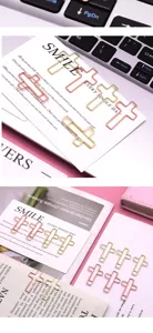 Creative metal cross paperclips in gold and rose gold, perfect for office and school stationery.