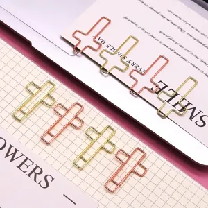Creative cross shaped metal paper clips in gold and rose gold, cute stationery office supplies.