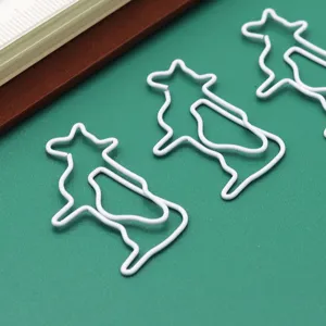 Cute cow shaped metal paper clips set, creative stationery for office and school organization.
