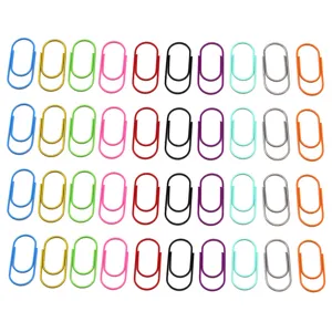 Colorful plastic-coated metal paperclips detail view, neatly arranged multi-color office clips