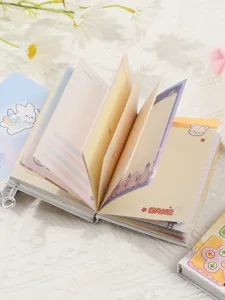 Macro view of colorful pixel game themed notebook pages with cute bunny illustrations