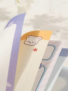 Close-up detail of colorful inner pages in a cute cartoon-themed student notebook journal