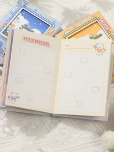 Detailed view of the colorful pixel game-themed notebook interior with cat illustrations