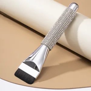 Detail view of luxury rhinestone flat foundation brush with shimmering silver handle design