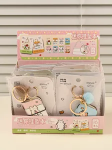 Mini notebook keychain detail, cute cat design PU leather pendant backpack accessory for keys.