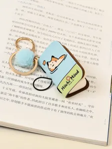 Mini PU leather notebook keychain with fluffy pom pom and cute cat design for bags.
