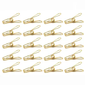 Petites pinces à poisson en métal doré trombones pour le classement des dossiers et documents.