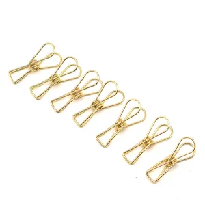 Mini clips en metal dore en forme de poisson pour le classement des documents details
