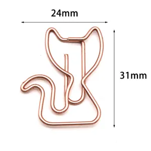 Rose gold cat shaped metal paperclip for office and school supplies, cute stationery item.