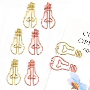 Graffette metalliche creative a forma di lampadina in oro e oro rosa per organizzare documenti.
