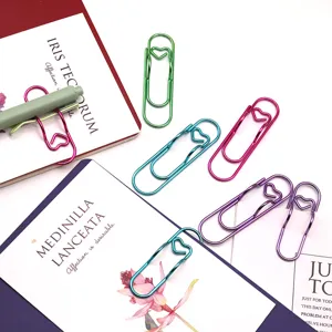 Colorful heart metal paperclips and pen clips for notebooks, creative office stationery.