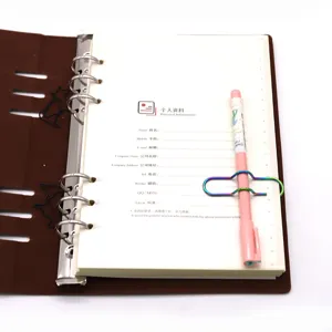 Creative metal colorful pen clip notebook set with cute cartoon paperclips and pen holder.