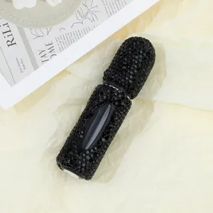 Macro shot of a luxury black rhinestone 5ml bottom-refill perfume atomizer bottle.