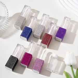 Macro detail view of colorful rhinestone-encrusted refillable lip gloss bottles for travel