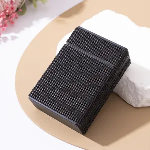 Detailed macro view of a luxury black rhinestone-encrusted cigarette storage case