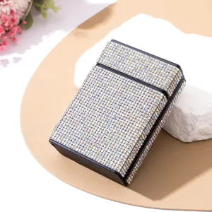 Macro view showing the exquisite iridescent rhinestone detail of this luxury cigarette case
