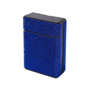Close-up view of a luxury cigarette case covered in shimmering blue rhinestones.