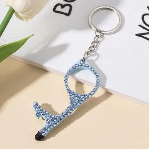 Detail of blue rhinestone-encrusted door opener keychain with touch screen stylus tip