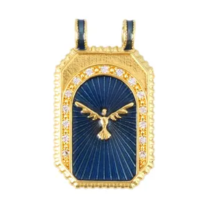 Close-up of golden vintage tarot pendant with blue enamel and winged bird figure
